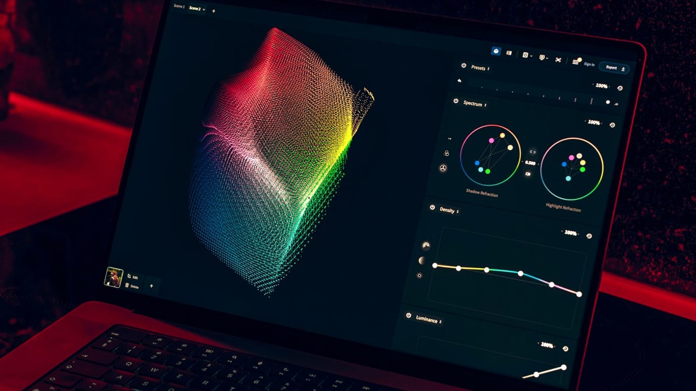 Laptop screen in a dark room showing a colorful three-dimensional data visualization with adjustment curves and controls