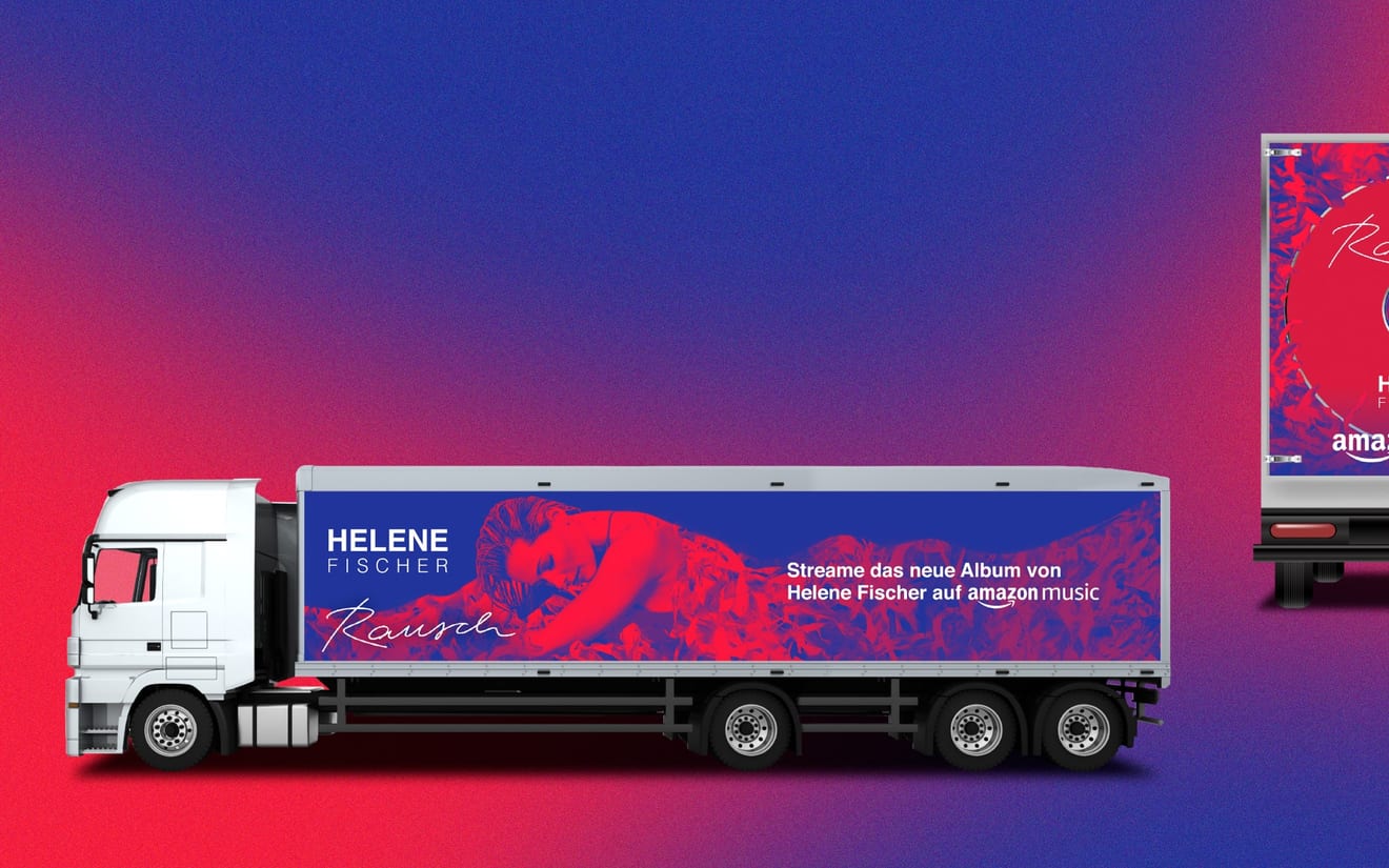Truck trailer wrapped in red and blue artwork promoting the Helene Fischer album Rausch on Amazon Music, next to a matching billboard